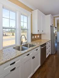 Kitchen White Cabinets With Dark Handles Love The Whole Color Scheme And Crown Moulding Home Kitchens White Kitchen Cabinets Kitchen Inspirations