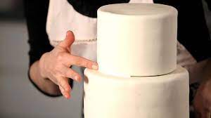 How To Hide Seams Between Tiers Wedding Cakes How To Make Wedding Cake Fondant Wedding Cakes Tiered Wedding Cake