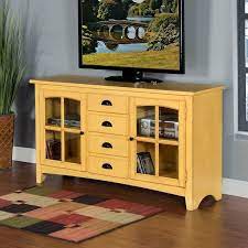 This console is available in cappuccino, plum purple, walnut, yellow, or teak (shown). Tuscan Yellow Element 64 Inch Tv Console By Sunny Designs Furniturepick
