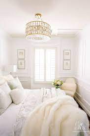 Glam Guest Bedroom White Walls Wainscoting Glam Gold Crystal Chandelier Guest Bedroom Makeover Bedroom Interior Bedroom Makeover