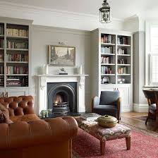 Design ideas for a medium sized victorian enclosed living room in london with grey walls, light hardwood flooring, a wood burning stove, a tiled fireplace surround, a wall mounted tv and brown floors. Pin By Scott Wagner On English Period Homes And English Style Victorian Living Room Living Room Grey Living Room Diy