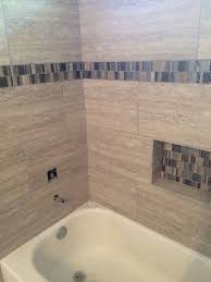 Amazing gallery of interior design and decorating ideas of shower tile border in bathrooms by elite interior designers. 12x24 Porcelain Tile With Mosaic Border And Custom Insert Gorgeous Bathroom Gorgeous Bathroom Tile Bathroom Remodel