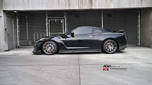 Stylish Gunmetal Adv1 Rims Adorning Black Nissan Gt R Nissan Gt Nissan Gt R Gtr