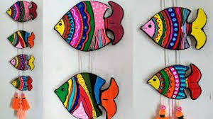 Complete the fish by adding small slats of wood to form the bones. Beautiful Home Decor From Waste Cardboard Cardboard Wall Hanging Fish Wall Hanging Youtube