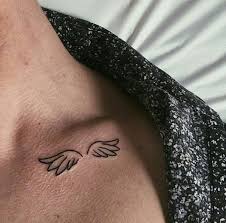 Black And White Angel Wings Tattoo Designs Small Angel Wings Tattoo On The Collarbone Black Shirt White Background In 2020 Simple Neck Tattoos Simple Angel Tattoos Small Angel Tattoo