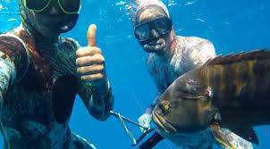 A person might be holding a spear, which was essentially a long and sharpened. Spearfishing Jamaica Videos Facebook