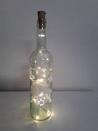 lightbottle bottle with light chain zen like picture light chain hand painted bottle hand painted flaschenleuchten weinflaschen dekorieren bemalte flasche