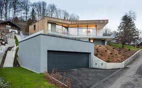 Browse 195 tools hanging in garage stock photos and images available, or search for tool chest or tools hanging on wall to find more great stock photos and pictures. 3 Storey Home On Steep Slope With Grass Roofed Garage Houses On Slopes House Architecture Design Architecture House