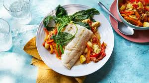 Place haddock fillets in a glass baking dish, and drizzle with melted butter. Smoked Haddock Recipes Bbc Food