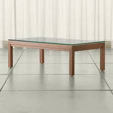 The rhapsody occasional collection brings a touch of sophistication to your living space, with the warm coffee finish and airy beveled glass tabletops. Parsons Clear Glass Top Elm Base 48x28 Small Rectangular Coffee Table Crate And Barrel Uae