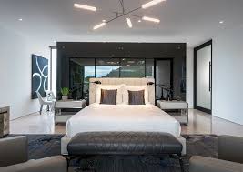 Inspiration for those whose homes express their passions. La Maison Interiors Modern Master Bedroom Interior Comfortable Leather Chairs