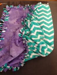 Begin to knot the pieces of fabric. 32 Diy Baby Blankets No Sew Ideas Tie Blankets Diy Baby Blankets No Sew Diy Baby Blanket