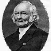 A man with glasses and a blue shirt. Alexandre padilha brazilian ministrry  of health.