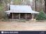 Log Home With Black Metal Roof
