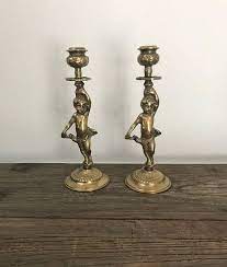 At 1stdibs, there are many versions of the ideal cherub candle holder for your home. A Pair Of Vintage Brass Angel Cherub Candlestick Holders Candlestick Holders Vintage Brass Candlesticks