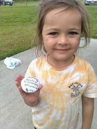 This is my beautiful grand daughter, Mila finding poppy's book in a shop.