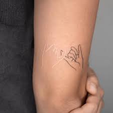 The promise tattoo is a symbol of commitment and we often look this kind of tattoos at the finger. Black And White Pinky Promise
