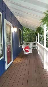 I decided to do all the pressure treated deck trim white to match the trim of my house and use a semi trans redwood for the decking. New Paint On The House Behr Admiral Blue With Behr Deckover Padre Brown With Behr Ruby Rose Front Door Color House Designs Exterior House Colors House Exterior