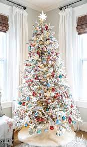 20 Incredibly Inspiring Ideas To Decorate With Flocked Christmas Trees Christmas Tree With Coloured Lights Flocked Christmas Trees Decorated Creative Christmas Trees