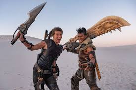 The movies plot is that two people from our universe somehow teleport in to the monster hunter universe and try to get back home. New Monster Hunter Movie Trailer Released Far More Impressive Than First Buss The World