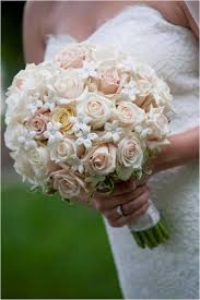 Classic bridal bouquet of white roses. Classic Ivory White Bouquet Rose Stephanotis Wedding Flowers Photos Pictures Weddingwire Co Wedding Flower Design Gold Wedding Theme Unique Bridal Bouquets