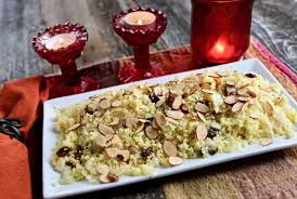 Meanwhile, in a small bowl whisk the cumin, ground coriander, cinnamon, turmeric, black pepper, grated garlic, lemon juice and olive oil with the boiling water. Saffron Couscous With Golden Raisins And Almonds Life At The Table