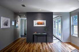 A dark grey contrast wall and statement grey sofa is softened with lighter tones and metallic textures in the venice lounge. Dark Grey Accent Wall Houzz
