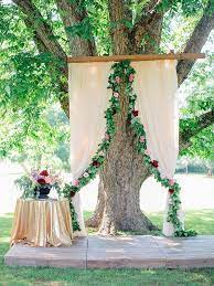 25 Pretty Rustic Wedding Decorations To Buy Now Outdoor Wedding Decorations Tree Wedding Ceremony Oak Tree Wedding