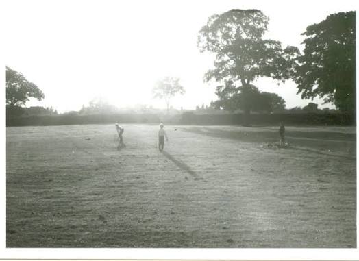 Kids play cricket, recognize the village? Circa 1980's