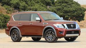 A white plastic fuse puller tool is included at the center of the passenger compartment fuse panel. First Drive 2017 Nissan Armada