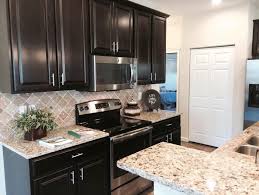 Modern Kitchen Dark Cabinets Grainte Island Sink The Chatham By Kmaronda Homes Citirama At Witherby Mead Modern Kitchen Dark Kitchen Cabinets Kitchen