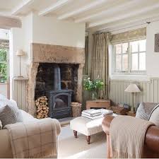While up to 90 per cent of the heat from an open fire can be lost up the chimney, a stove benefits from increased efficiency, radiating more heat throughout the room. Pin By Katy On Classroom Ideas Country Cottage Living Room Country Cottage Living Cottage Living Rooms