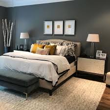 The nester glamorous bedroom with gray walls paint color, diy white poster board sunburst mirror, joss & main gray tufted wingback bed with silver nailhead trim, one kings. How To Go Gray When Your Entire House Is Beige Designed