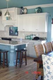 Open shelving, painted cabinets and handmade accessories create a delightful space to cook and eat. Color Schemes Color Inspiration Beach Coastal Decor Color Schemes Inspiration Preview Pattern Description A Short Des Home Decor Beach Kitchens Home