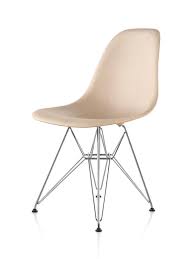The original fiberglass chair is molded to be a comfortable seat and the legs are made from steel. Eames Molded Wood Side Chair Herman Miller