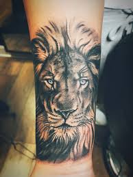 Black And White Lion Wrist Tattoo With Blue Eyes Lion Tattoo Sleeves Small Lion Tattoo Lion Tattoo Design