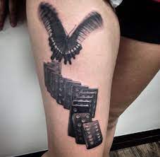 Butterfly And Dominoes Tattoo In Grey Shade Text Tattoo Tattoos Frog Tattoos