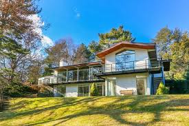 Glass house in the garden. On The Market A Midcentury Modern Home In Dedham With A Greenhouse