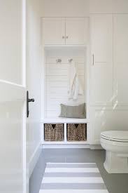 This is especially true for the bathroom that we have in our bedroom. Bathroom In Mudroom Features An Under Window Toilet Alongside A White And Gray Stripe Rug Layered Atop Pool House Bathroom Pool Bathroom Small Bathroom Storage