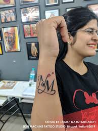 N M Initial Tattoo By Akash Marotkar Akky Skin Machine Tattoo Studio Email For Appointments Skinmachineteam In 2020 Tattoo Studio Girl Arm Tattoos Initial Tattoo