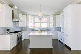 Welcoming U Shaped Kitchen Boasts A Bay Window Positioned Above A Sink Paired Wit Kitchen Remodel Countertops Cheap Kitchen Remodel Kitchen Remodeling Projects