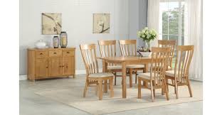 Brown oak effect dining table and 4 faux leather chairs. Annaghmore Kilmore Oak Extending Dining Table 4 Chairs