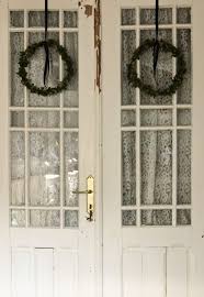 here the curtains are on the inside of the french door don t know which one i like better i pinne french doors interior hanging barn doors front door decor