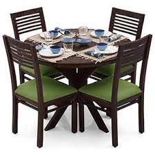 Hardwood 4 seater garden dining set with free cushions by liz frances. Liana Zella 4 Seater Dining Table Set Urban Ladder