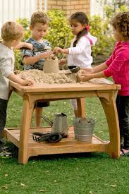 Wet And Messy Play In An Outdoor Sensory Table In 2020 Water Play Outdoor Toys Sand And Water