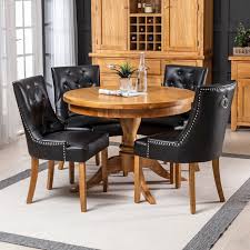 Shop online for chairs and benches in modern upholstery such as velvet, leather and rattan. Solid Oak Round Dining Table And 4 Black Faux Leather Scoop Chairs The Furniture Market