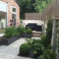 Small Terrace Design Ideas With Dark Furniture And Potted Greenery Garden Ideas Terraced House Small Backyard Landscaping Garden Front Of House