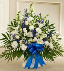Description this floral funeral template has editable text and photos boxes to personalize yourself. Blue Flower Arrangement For Sympathy And Funeral Profuneralflowers Com