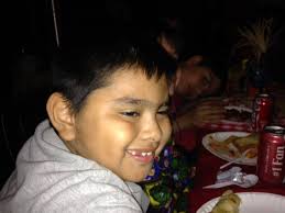 Principal Resident, Beth Kenny, and Bryant Webster students wait for the  Hunger Banquet to begin in the Little Man amphitheater