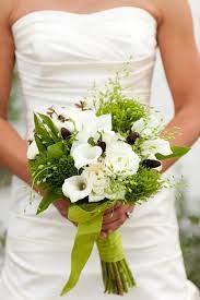 Varying shades of green are accented with cream and white flowers in this simple and bold bridal bouquet. Building A Beautiful Calla Lily Wedding Bouquet Topweddingsites Com
